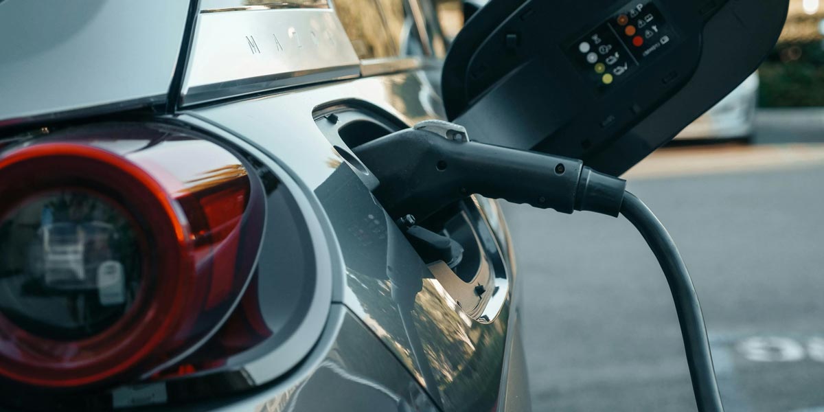 An electric car attached to an EV charger